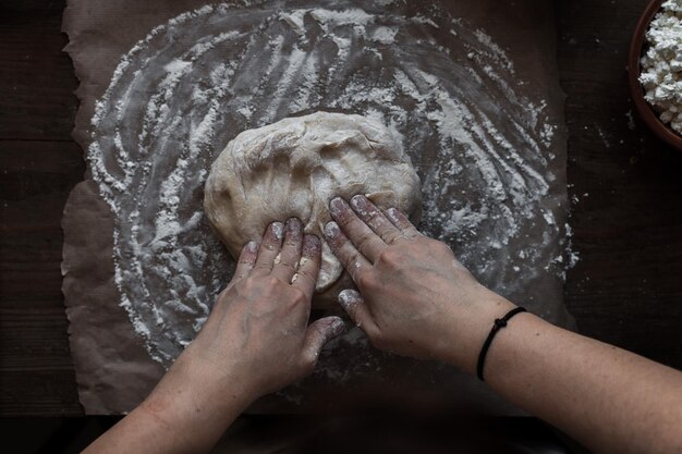 hands kneading dough